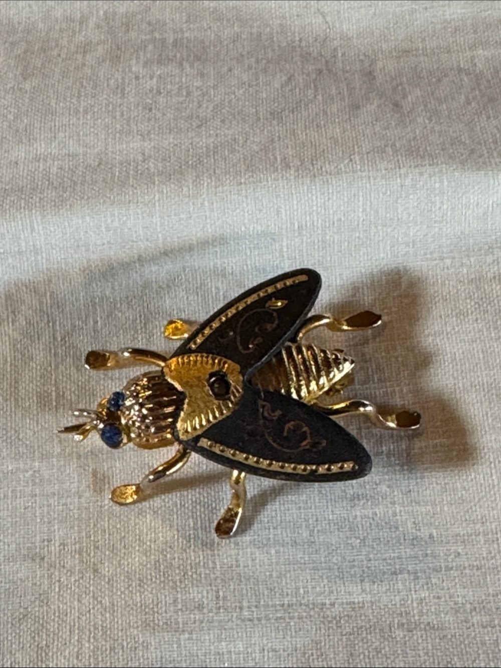 Gold Tone Bee Brooch with Black Enamel and Blue Rhinestones